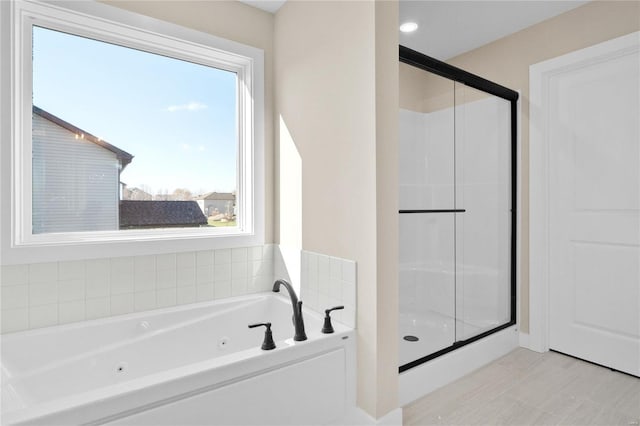 bathroom with tile patterned flooring and plus walk in shower