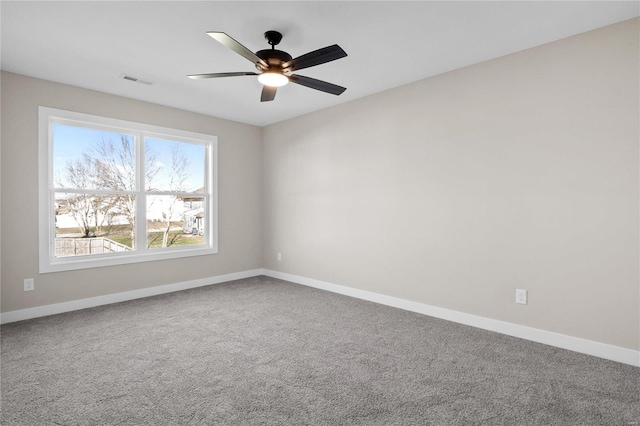 empty room featuring ceiling fan and carpet flooring