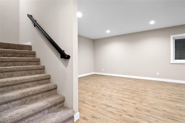 stairway featuring hardwood / wood-style flooring