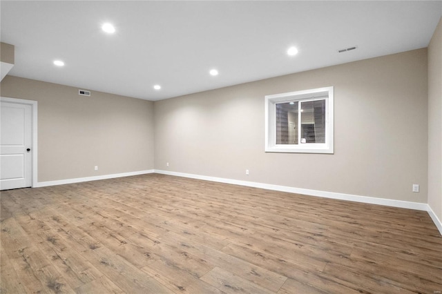 spare room featuring light hardwood / wood-style flooring