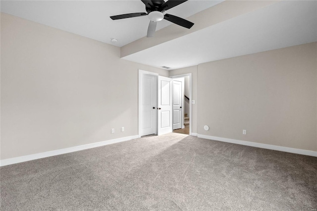 interior space featuring ceiling fan and carpet flooring