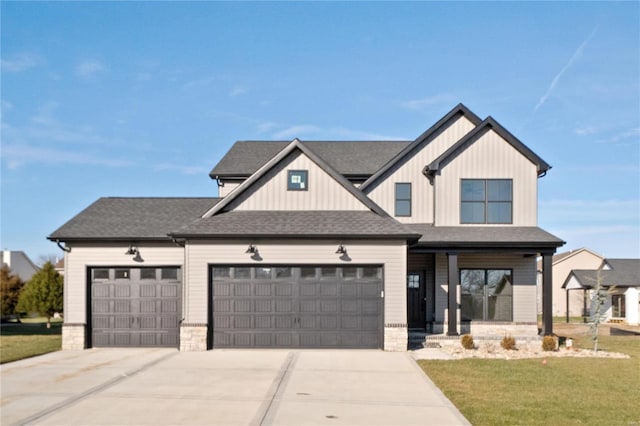 view of front facade with a front lawn and a garage