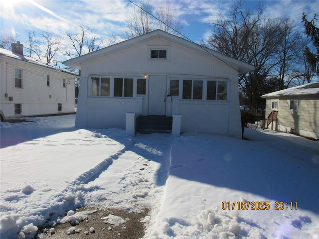 exterior space with an outbuilding and a garage