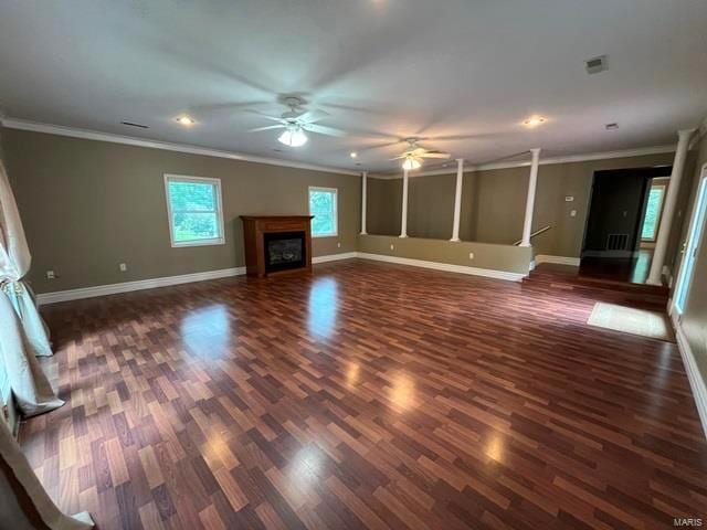 unfurnished living room with crown molding, ceiling fan, and dark hardwood / wood-style floors