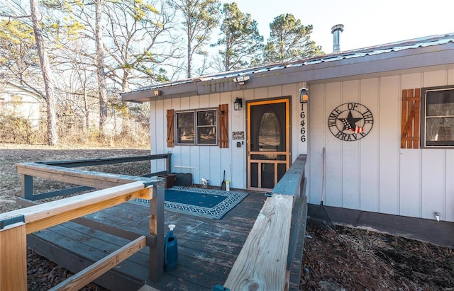 property entrance with a deck