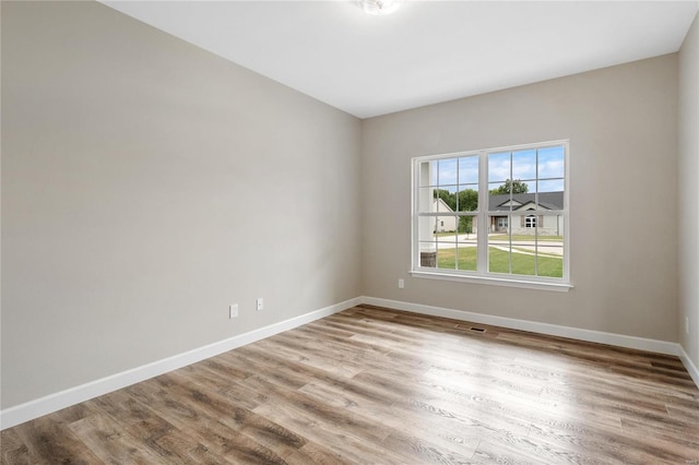 empty room with light wood-type flooring