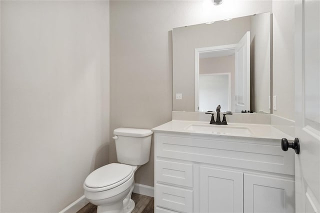 bathroom with toilet and vanity