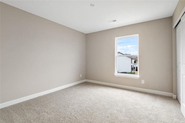 unfurnished room with carpet flooring