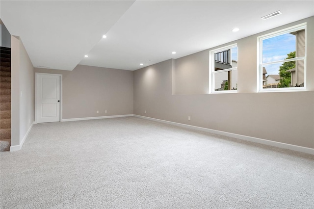 unfurnished room with light colored carpet