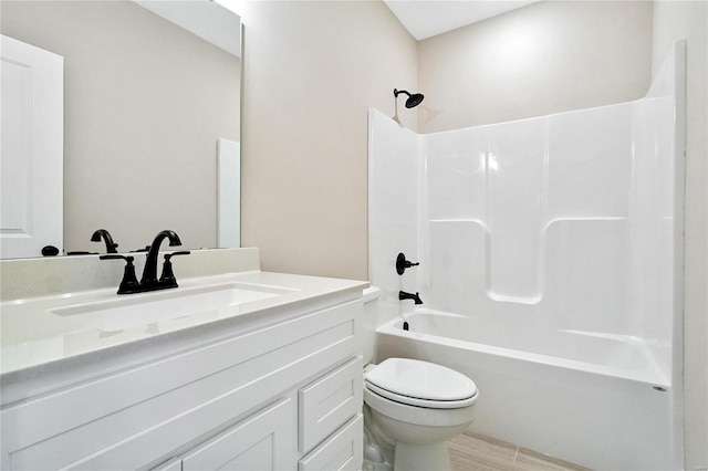 full bathroom featuring toilet, vanity, and shower / bathing tub combination