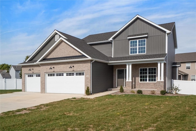 craftsman-style home featuring a front yard and a garage