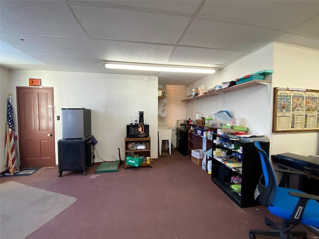 office with carpet floors and a paneled ceiling