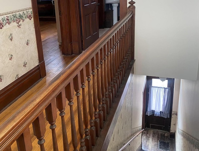 stairway with wood-type flooring