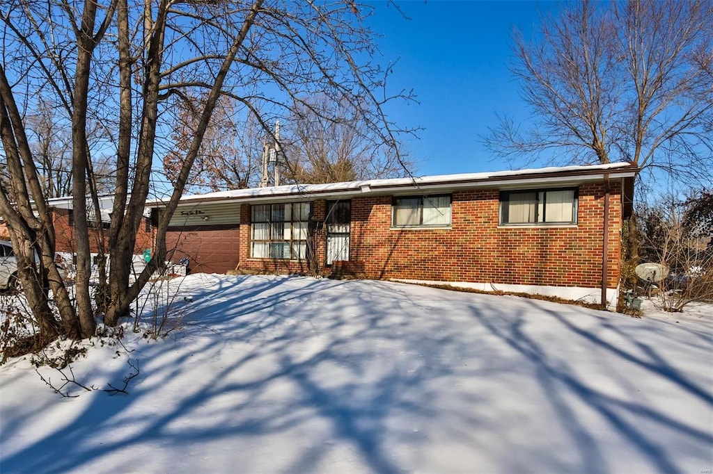 single story home with a garage