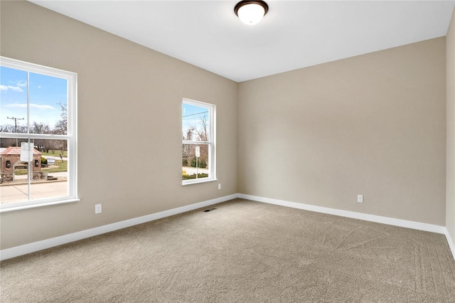 empty room featuring carpet floors