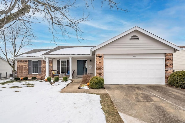 ranch-style house with covered porch and a garage