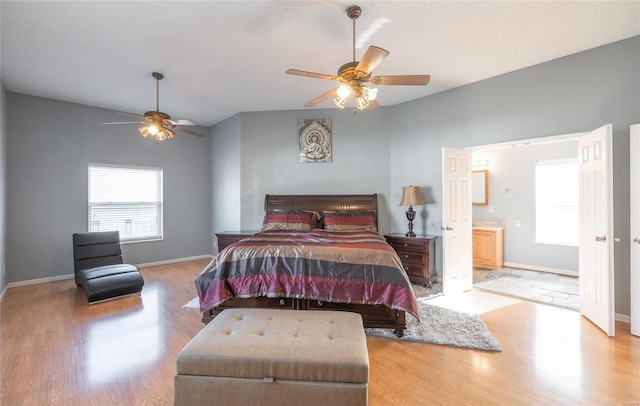 bedroom featuring light wood-type flooring, ensuite bath, and ceiling fan