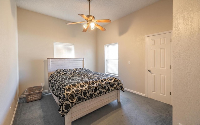 carpeted bedroom with ceiling fan, a textured ceiling, and lofted ceiling