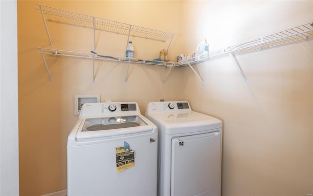 washroom with washer and clothes dryer