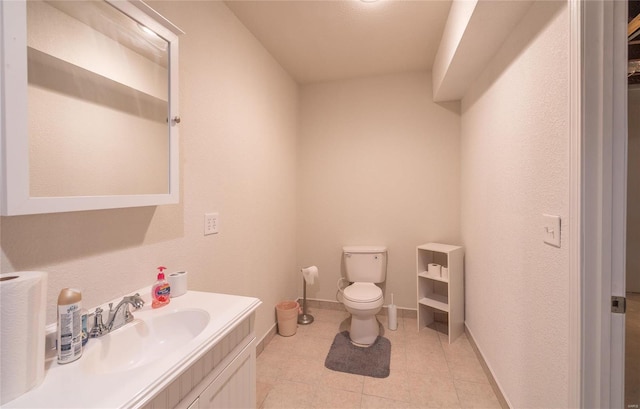 bathroom with toilet and vanity