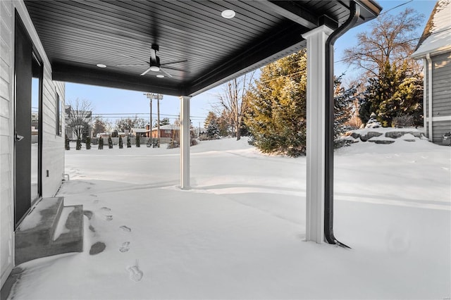 yard covered in snow with ceiling fan