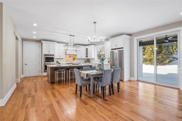 dining room with light hardwood / wood-style flooring