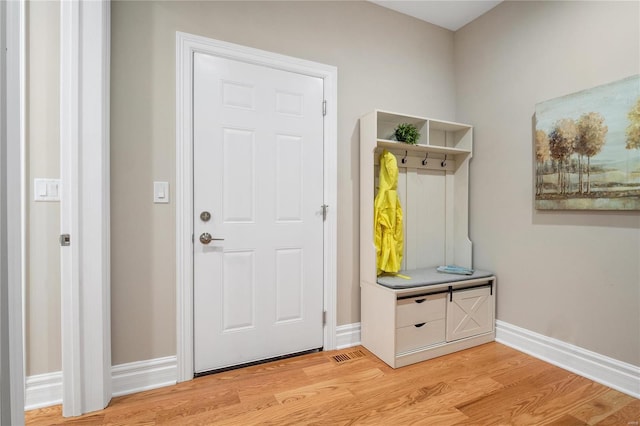 mudroom with light hardwood / wood-style floors