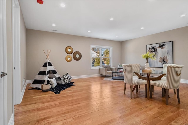 dining area with light hardwood / wood-style flooring