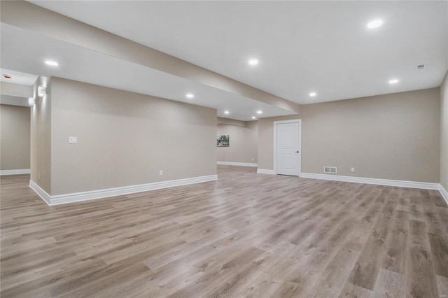 basement featuring light hardwood / wood-style floors