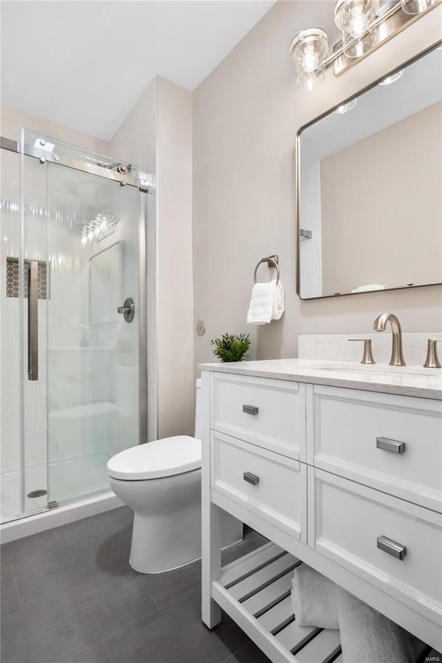 bathroom with toilet, tile patterned flooring, an enclosed shower, and vanity