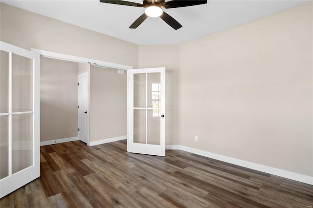 unfurnished bedroom featuring ceiling fan, dark wood-type flooring, and french doors