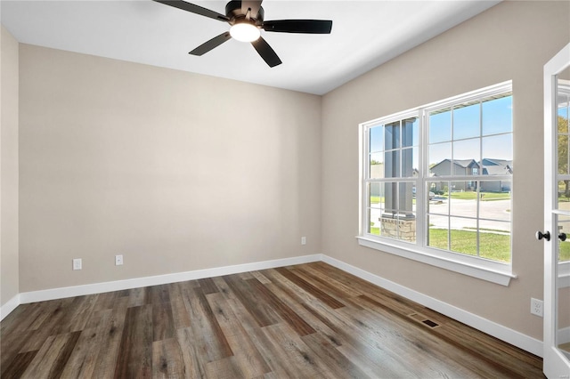 spare room featuring ceiling fan and wood-type flooring