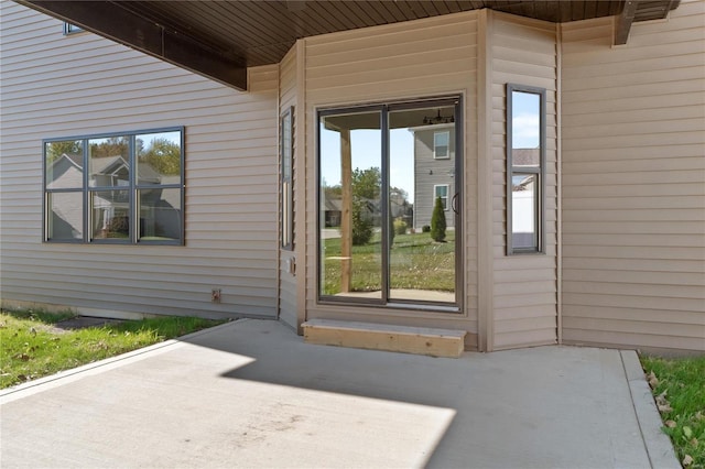 property entrance with a patio