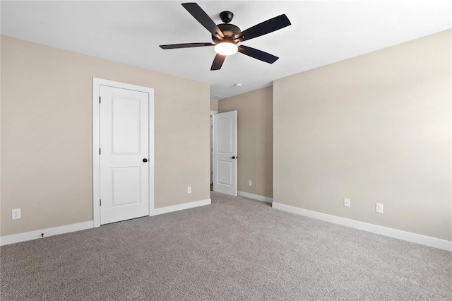 unfurnished bedroom with ceiling fan and carpet