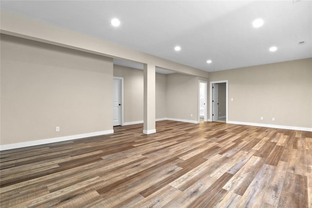 basement with hardwood / wood-style floors