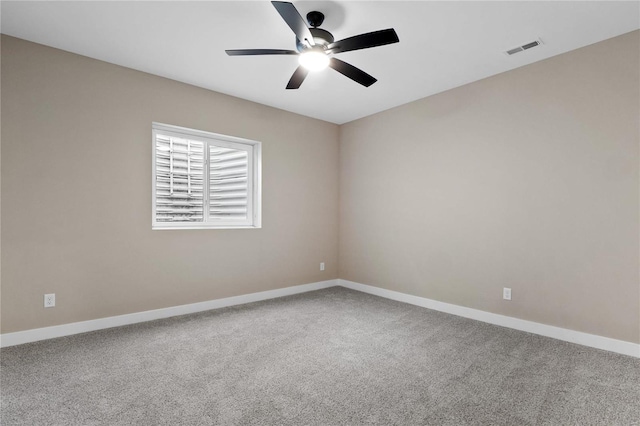 carpeted empty room with ceiling fan