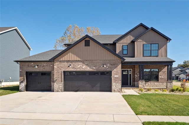 craftsman inspired home featuring a front lawn and a garage