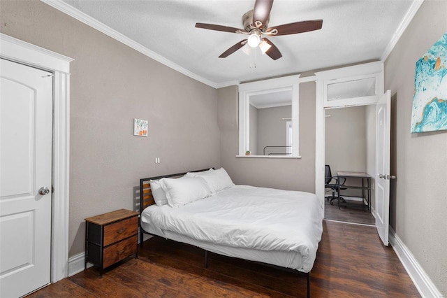 bedroom with dark wood-type flooring, ceiling fan, and crown molding