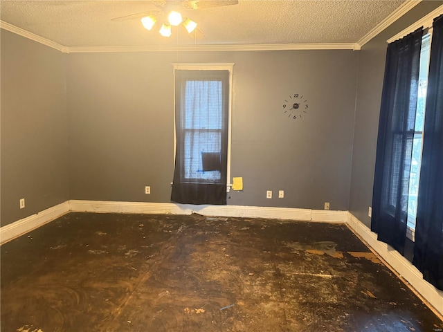 empty room featuring a textured ceiling, ceiling fan, and crown molding