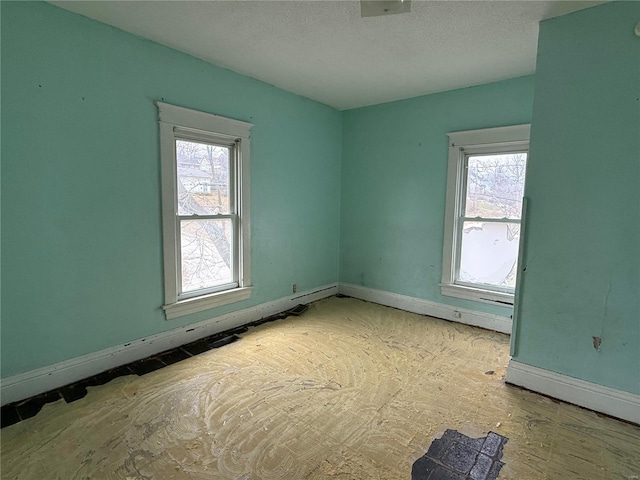 spare room featuring a wealth of natural light