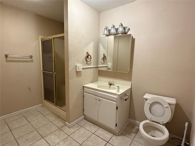 bathroom featuring toilet, tile patterned flooring, a shower with shower door, and vanity