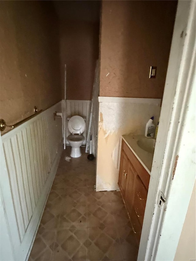 bathroom featuring toilet and vanity