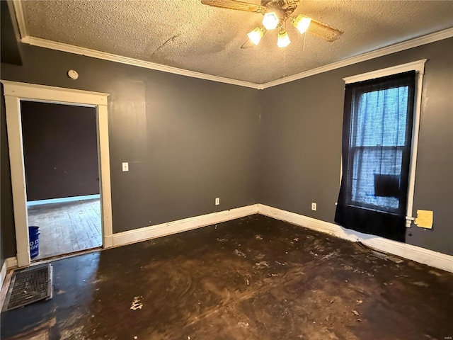 spare room with ceiling fan, a textured ceiling, and ornamental molding