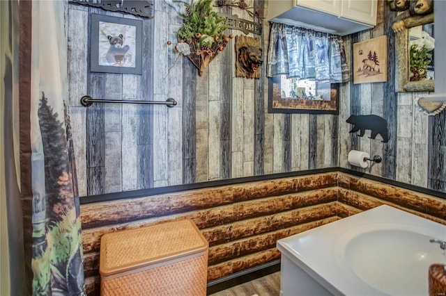 bathroom with hardwood / wood-style floors and vanity