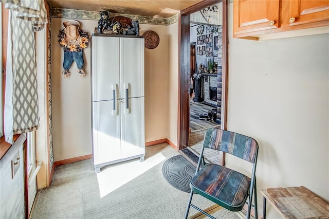 kitchen featuring light carpet