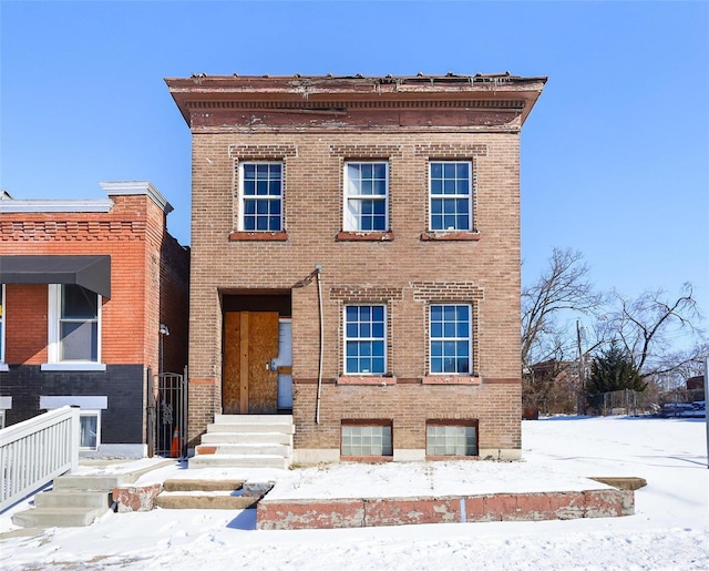 view of front of house with brick siding