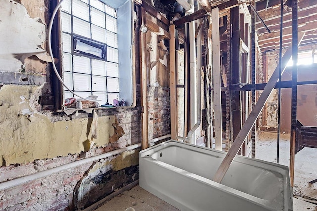 full bathroom with a tub to relax in