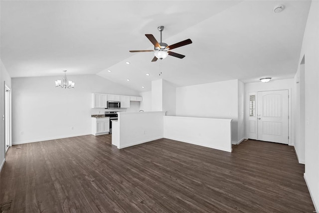 unfurnished living room with vaulted ceiling, dark wood-type flooring, and ceiling fan with notable chandelier