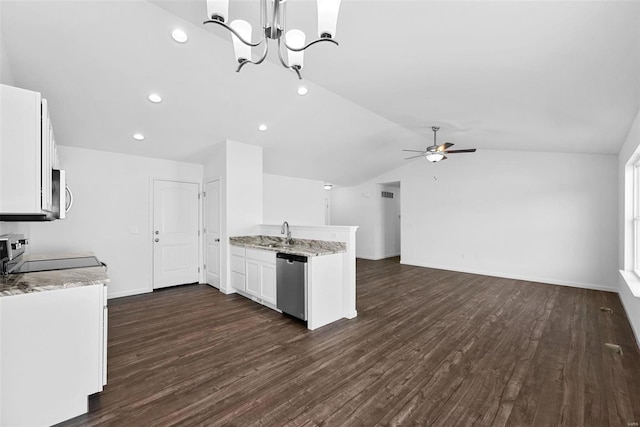 kitchen featuring sink, white cabinetry, appliances with stainless steel finishes, light stone counters, and ceiling fan with notable chandelier