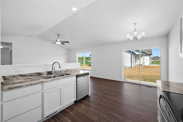 kitchen featuring ceiling fan with notable chandelier, white cabinets, dishwasher, lofted ceiling, and sink